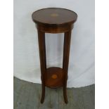 Edwardian mahogany circular plant stand with satinwood inlays on four outswept legs