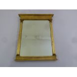 A rectangular gilt wood and brass wall mirror of classical architectural form, 53 x 37cm