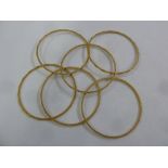 Six gold bangles, tested 21ct, approx total weight 41.6g