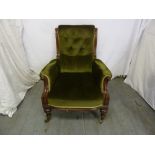 Victorian mahogany armchair, button back on four scroll legs with original castors