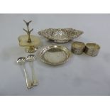 A silver hallmarked shaped oval bonbon dish and two napkin rings, two condiment spoons, a coaster