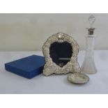 A silver mounted photograph frame in original packaging, a cut glass decanter with drop stopper