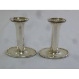 A pair of silver shaped oval filled dwarf candlesticks, Birmingham 1919