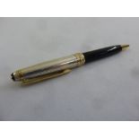 A Mont Blanc Meisterstuck roller ball pen with silver and gold plated cover presented by JP Morgan