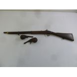 A 19th century flintlock rifle and two leather shot holders