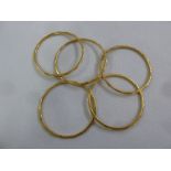 Five gold bangles, tested 21ct, approx total weight 53.3g