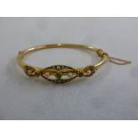15ct yellow gold seed pearl and emerald bangle, approx total weight 9.8g