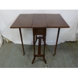 A 19th century mahogany rectangular drop flap table