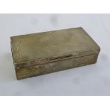 A silver rectangular engine turned cigarette box with cedarwood lining, Birmingham 1934