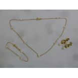 A quantity of 9ct gold jewellery to include a necklace, bracelet and a pair of earrings, approx