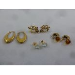 Four pairs of 9ct gold earrings set with various stones, approx total weight 15.7g