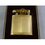 A Ronson 9ct gold engine turned cigarette lighter in original fitted case