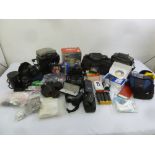 A mixed quantity of cameras, lenses and accessories