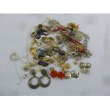 A quantity of costume jewellery to include necklaces, earrings and brooches