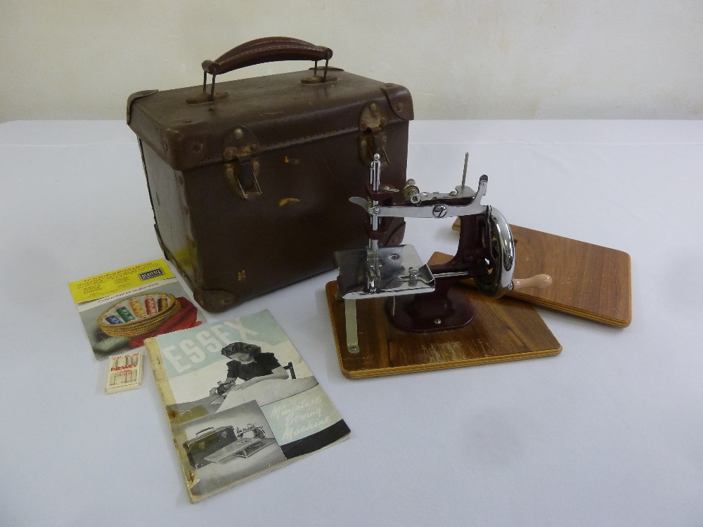 An Essex miniature sewing machine in original fitted case