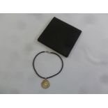 Bulgari 18ct gold star set in a steel ring with leather necklace in original leather pouch