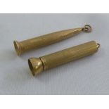 Two retractable 9ct gold engine turned cigar piercers