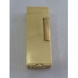 A Dunhill 14ct gold ribbed cigarette lighter