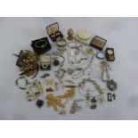 A quantity of costume jewellery to include necklaces, earrings, brooches and pendants