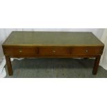 A mahogany brass bound campaign table, rectangular with tooled leather top, three drawers, on four