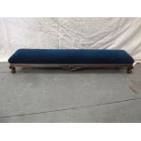 A Victorian upholstered rectangular foot stool on four scroll legs, 130 x 29cm
