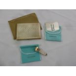 A Tiffany white metal cigar cutter, money clip and cigarette case all in original pouches