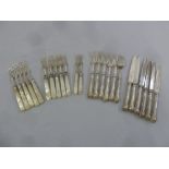 A quantity of silver and mother of pearl dessert forks and a set of six fish eaters with filled