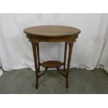 An Edwardian mahogany oval side table with satinwood inlay