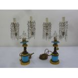 A pair of brass, glass and ceramic two branch table lamps with cut glass drop pendants A/F