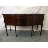 A Regency style mahogany sideboard with two drawers flanked on either side by two cupboards on