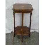 An Edwardian rectangular two-tiered mahogany side table