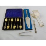 A quantity of silver to include a cased set of teaspoons, a cake slice, a pair of asparagus tongs, a