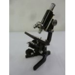 A Watson Barnet microscope of customary form