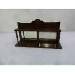 An Edwardian rectangular mahogany mirror backed wall shelf