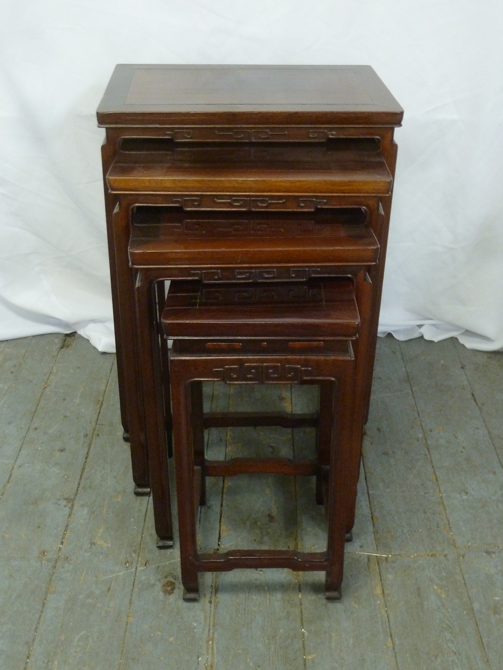 An Oriental rectangular hardwood nest of four tables