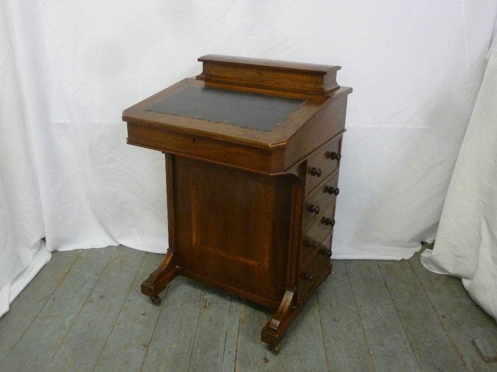 A late 19th century mahogany Davenport of customary form with tooled leather top