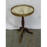 A circular mahogany and marble occasional table with gilt metal gallery on tripod base