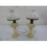 A pair of Victorian glass oil lamps with glass shades later converted to electricity, A/F