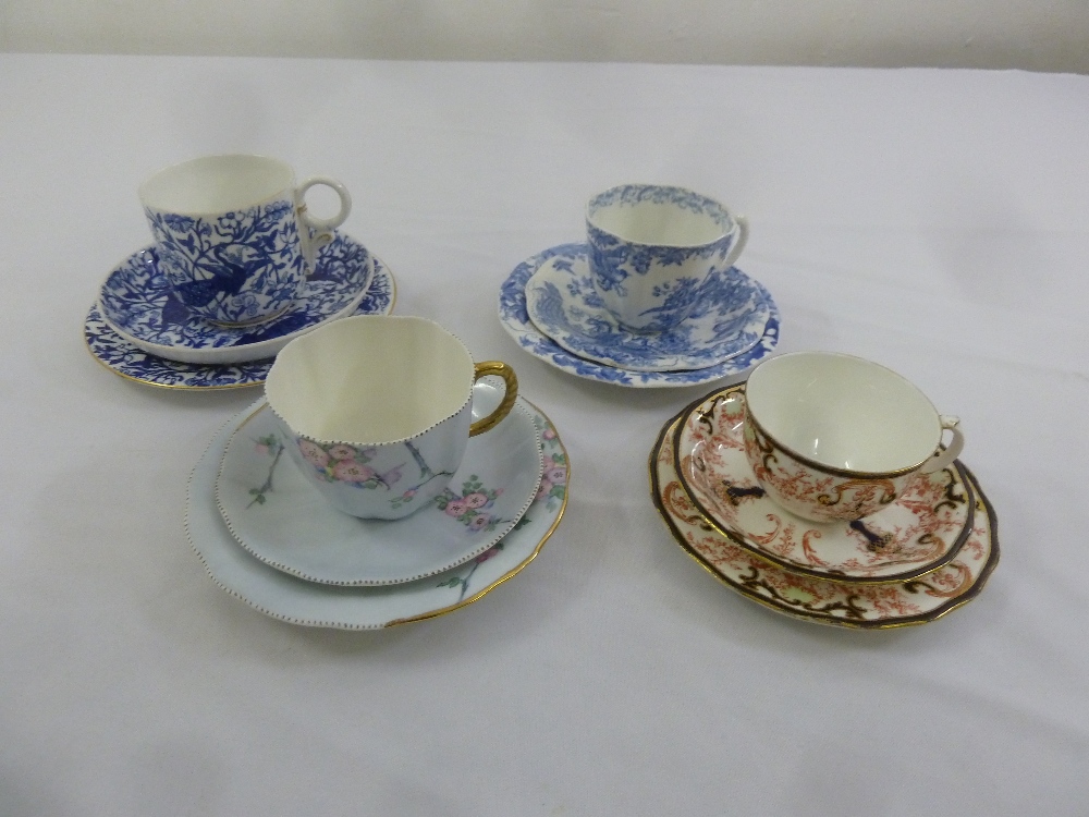 Four matching trios of Royal Crown Derby cabinet cups, saucers and plates (12)