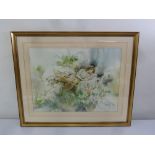 Gordon King a framed and glazed watercolour of a recumbent lady amidst flowers, signed bottom right,