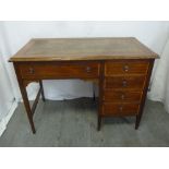 An Edwardian rectangular knee hole desk, the five drawers with brass handles