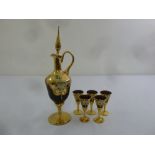 A Venetian red and gilt glass carafe with five matching glasses