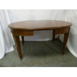 A Victorian mahogany oval dining table on four tapering rectangular legs with one drop in leaf and