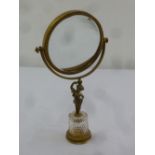 A Continental brass and glass dressing table mirror