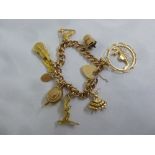 9ct gold charm bracelet with nine charms and a lock, approx total weight 28.8g