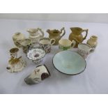 A quantity of hunting themed porcelain to include jugs, mugs and a stirrup cup in the form of a