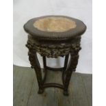A Chinese hardwood plant stand with inset marble top