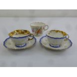 A Meissen tea cup and pair of cups and saucers with marks to the base, A/F