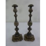 A pair of silver hallmarked table candlesticks, knopped baluster stems, London 1920