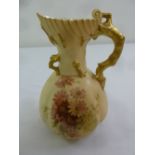 Royal Worcester Blush Ivory water jug decorated with painted flowers and gilded decorations